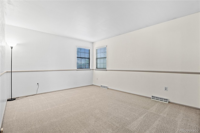 7888 S Poplar Way, Centennial, CO 80112 - spare room featuring carpet flooring