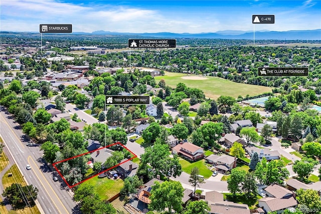 7888 S Poplar Way, Centennial, CO 80112 - aerial view of residential area featuring property parcel outlined and a mountain backdrop