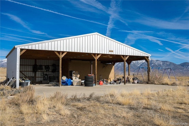 view of home's community featuring an outbuilding and a mountain view