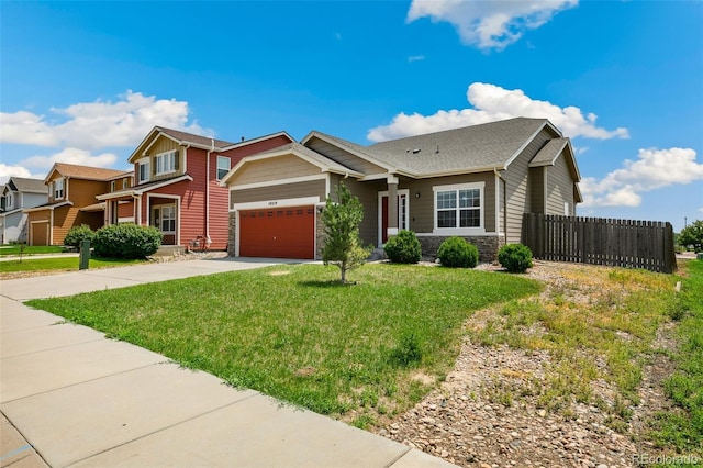 view of front of home featuring a garage and a front yard