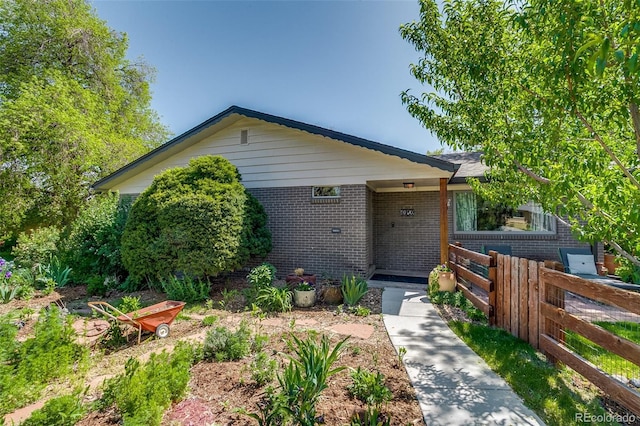 3010 Zinnia Ct, Golden, CO 80401 - single story home featuring brick siding and fence
