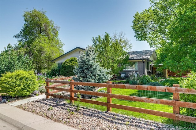 3010 Zinnia Ct, Golden, CO 80401 - view of front of home with a fenced front yard and brick siding