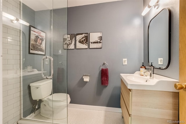 3010 Zinnia Ct, Golden, CO 80401 - full bathroom with tile patterned flooring, toilet, a stall shower, and vanity