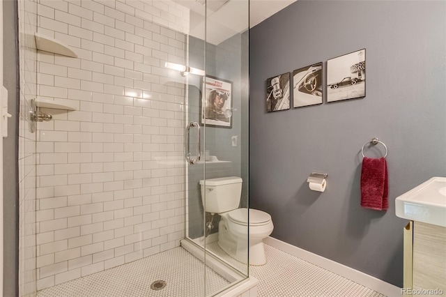 3010 Zinnia Ct, Golden, CO 80401 - bathroom with a shower stall, toilet, and tile patterned floors