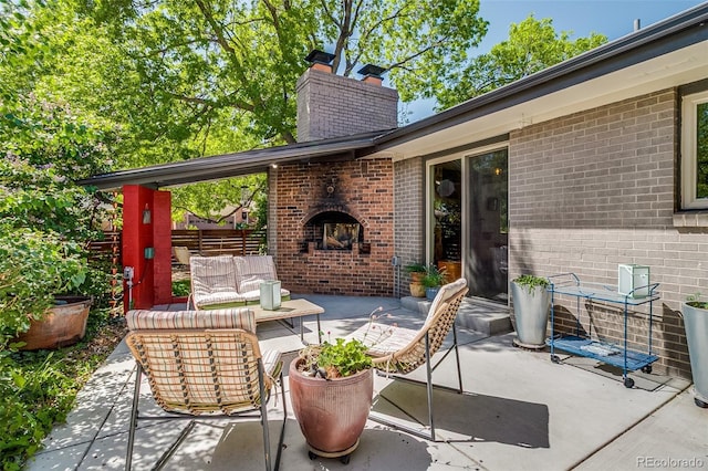 3010 Zinnia Ct, Golden, CO 80401 - view of patio featuring an outdoor living space with a fireplace and fence