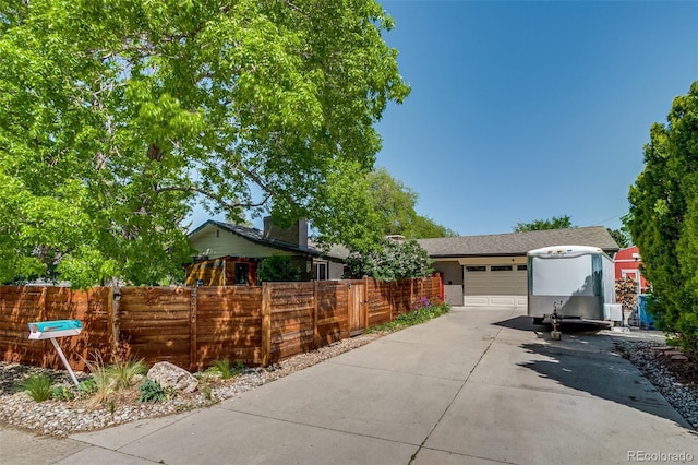 3010 Zinnia Ct, Golden, CO 80401 - view of front facade with concrete driveway, an attached garage, and fence