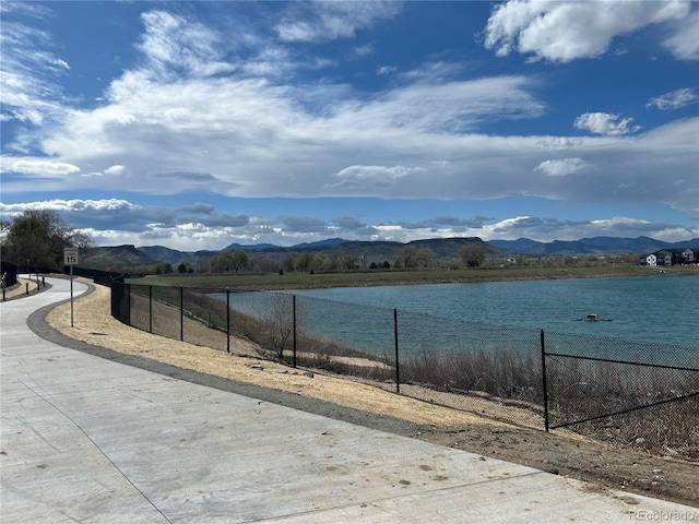 3010 Zinnia Ct, Golden, CO 80401 - water view featuring fence and a mountain backdrop