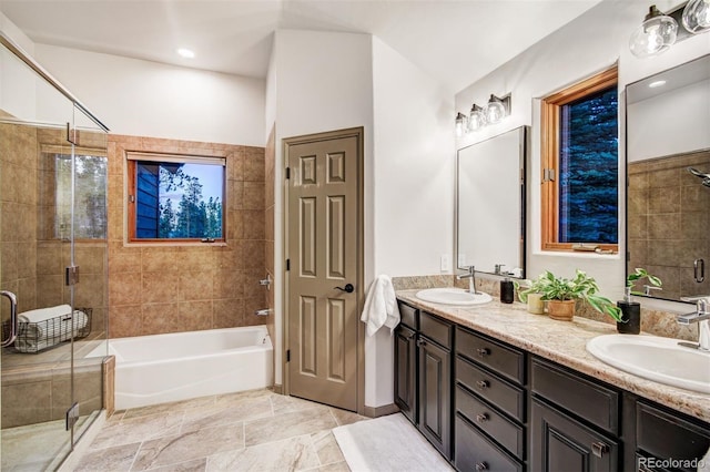 bathroom featuring separate shower and tub and vanity