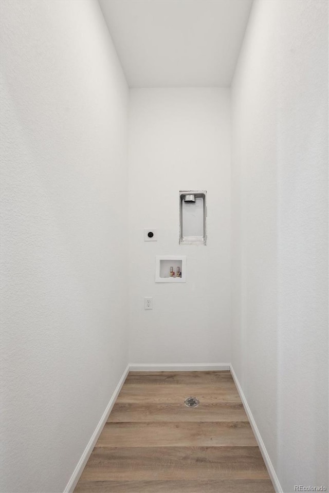 washroom featuring hookup for a washing machine, wood-type flooring, and electric dryer hookup