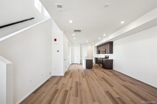 unfurnished living room featuring light hardwood / wood-style floors