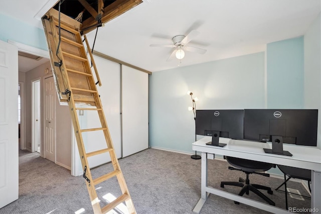 office featuring carpet floors, ceiling fan, and baseboards