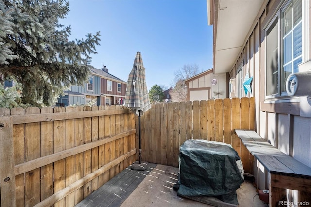 view of patio / terrace featuring fence and grilling area