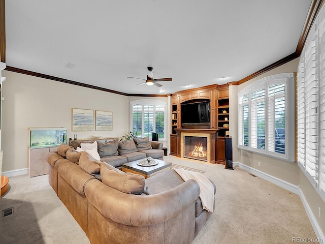 291 Fairchild Dr, Highlands Ranch, CO 80126 - living room with a large fireplace, light carpet, ceiling fan, ornamental molding, and baseboards