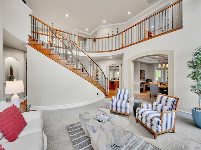 291 Fairchild Dr, Highlands Ranch, CO 80126 - living area featuring carpet, arched walkways, baseboards, recessed lighting, and a high ceiling