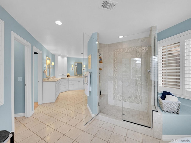 291 Fairchild Dr, Highlands Ranch, CO 80126 - bathroom with a shower stall, double vanity, tile patterned floors, recessed lighting, and baseboards