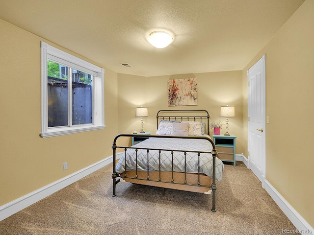 291 Fairchild Dr, Highlands Ranch, CO 80126 - bedroom with carpet floors, a textured ceiling, and baseboards