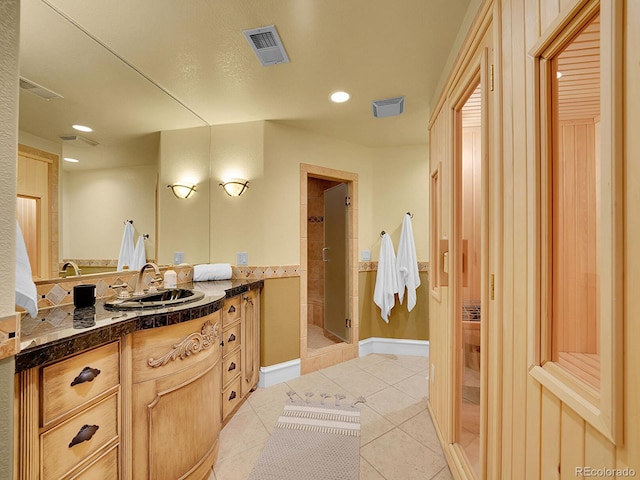 291 Fairchild Dr, Highlands Ranch, CO 80126 - full bath with vanity, a stall shower, tile patterned flooring, and recessed lighting