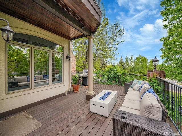 291 Fairchild Dr, Highlands Ranch, CO 80126 - wooden terrace featuring an outdoor living space with a fire pit