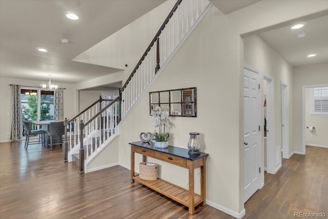 3762 White Rose Loop, Castle Rock, CO 80108 - stairway featuring a chandelier, wood finished floors, healthy amount of natural light, and recessed lighting