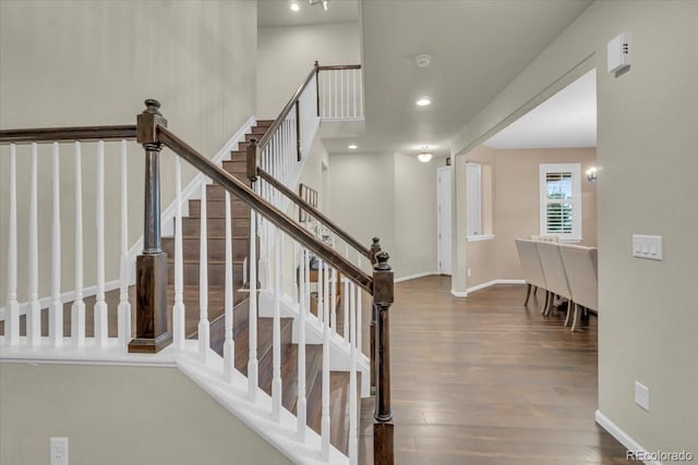 3762 White Rose Loop, Castle Rock, CO 80108 - stairway featuring wood finished floors and recessed lighting