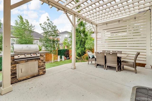 3762 White Rose Loop, Castle Rock, CO 80108 - view of patio / terrace featuring outdoor dining space, a pergola, and an outdoor kitchen