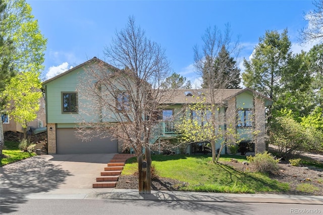 1045 Golden Hills Rd, Colorado Springs, CO 80919 - split level home with a garage, driveway, brick siding, and a front yard