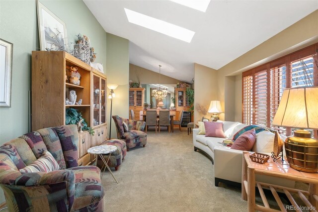1045 Golden Hills Rd, Colorado Springs, CO 80919 - carpeted living area with a notable chandelier and vaulted ceiling with skylight