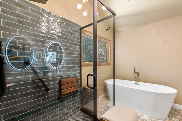 1045 Golden Hills Rd, Colorado Springs, CO 80919 - full bath with a freestanding tub, baseboards, a shower stall, and tile patterned floors