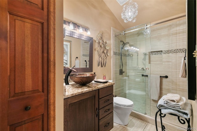 1045 Golden Hills Rd, Colorado Springs, CO 80919 - full bath with vanity, vaulted ceiling, toilet, and a shower stall