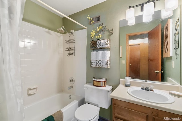 1045 Golden Hills Rd, Colorado Springs, CO 80919 - bathroom featuring shower / bath combo with shower curtain, visible vents, toilet, and vanity