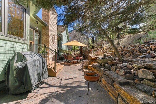 1045 Golden Hills Rd, Colorado Springs, CO 80919 - view of patio featuring outdoor dining area and a grill