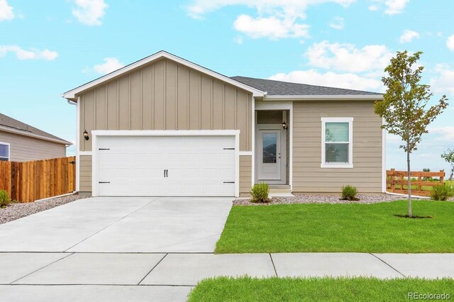ranch-style home with driveway, an attached garage, and board and batten siding