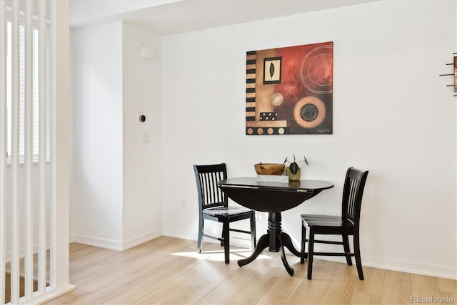 dining area with light hardwood / wood-style floors