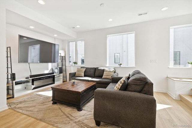 living room with light hardwood / wood-style floors