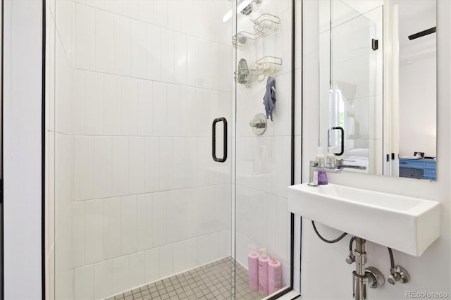 bathroom featuring a shower with door