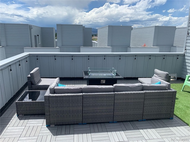 view of patio / terrace featuring an outdoor living space and a wooden deck