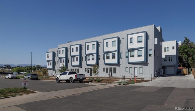 view of building exterior featuring a mountain view