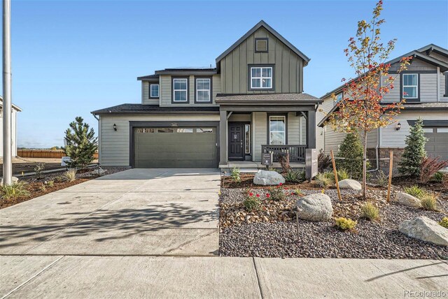 5572 Runge Ct, Timnath, CO 80547 - view of front of house featuring a garage, a porch, board and batten siding, and concrete driveway
