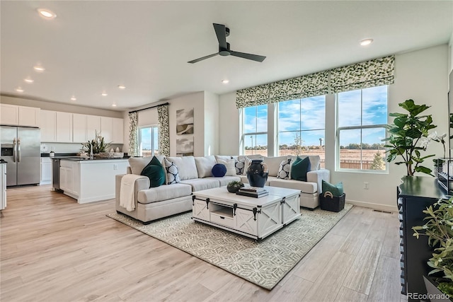 5572 Runge Ct, Timnath, CO 80547 - living room featuring baseboards, recessed lighting, a ceiling fan, and light wood finished floors