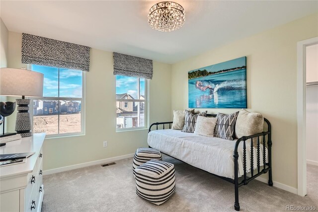 5572 Runge Ct, Timnath, CO 80547 - sitting room with light colored carpet, visible vents, a notable chandelier, and baseboards