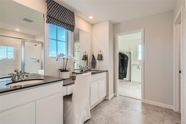 5572 Runge Ct, Timnath, CO 80547 - full bathroom with visible vents, baseboards, recessed lighting, vanity, and a stall shower