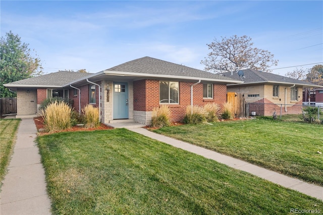 ranch-style house with a front lawn