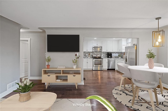 living room with dark hardwood / wood-style floors