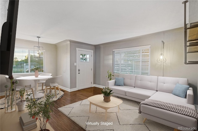 living room featuring dark wood-type flooring