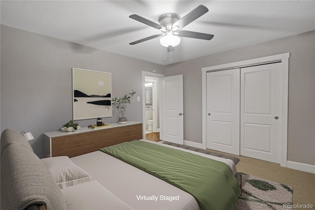 bedroom with light carpet, ceiling fan, and a closet