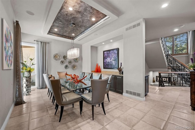 dining room featuring a tray ceiling