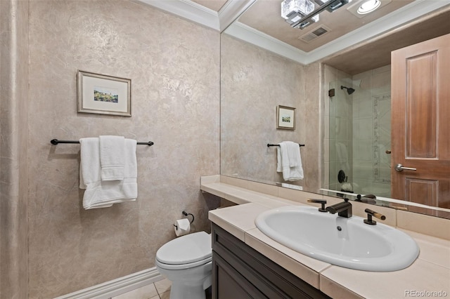 bathroom with tile patterned floors, toilet, ornamental molding, vanity, and a shower with door