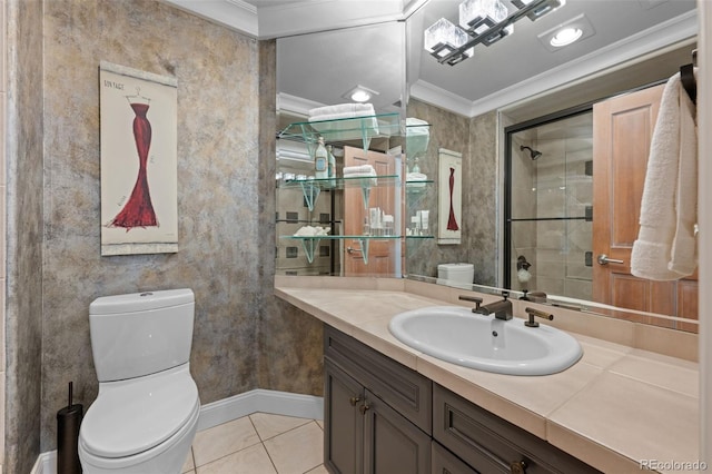 bathroom with tile patterned floors, ornamental molding, toilet, and vanity