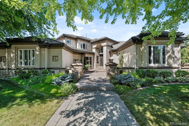 prairie-style house featuring a front yard