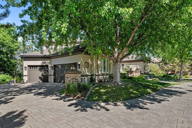 obstructed view of property with a garage